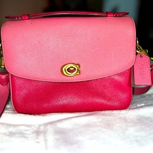 Coach “envelope” style bag, two tone magenta in color